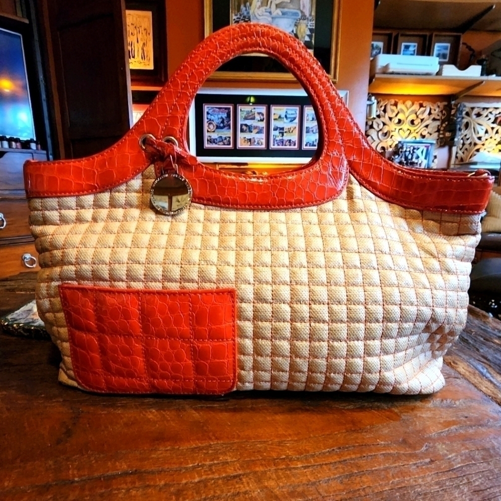 STUART WEITZMAN quilted tote with orange patent leather accents & gold hardware